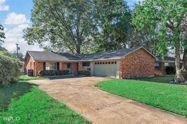 single story home featuring a garage and a front lawn