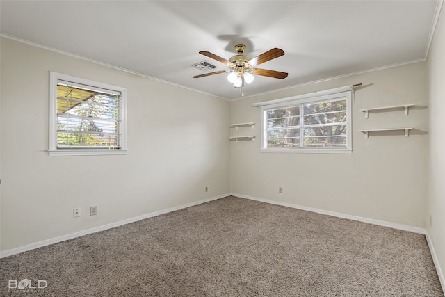 empty room featuring carpet floors, ceiling fan, and crown molding