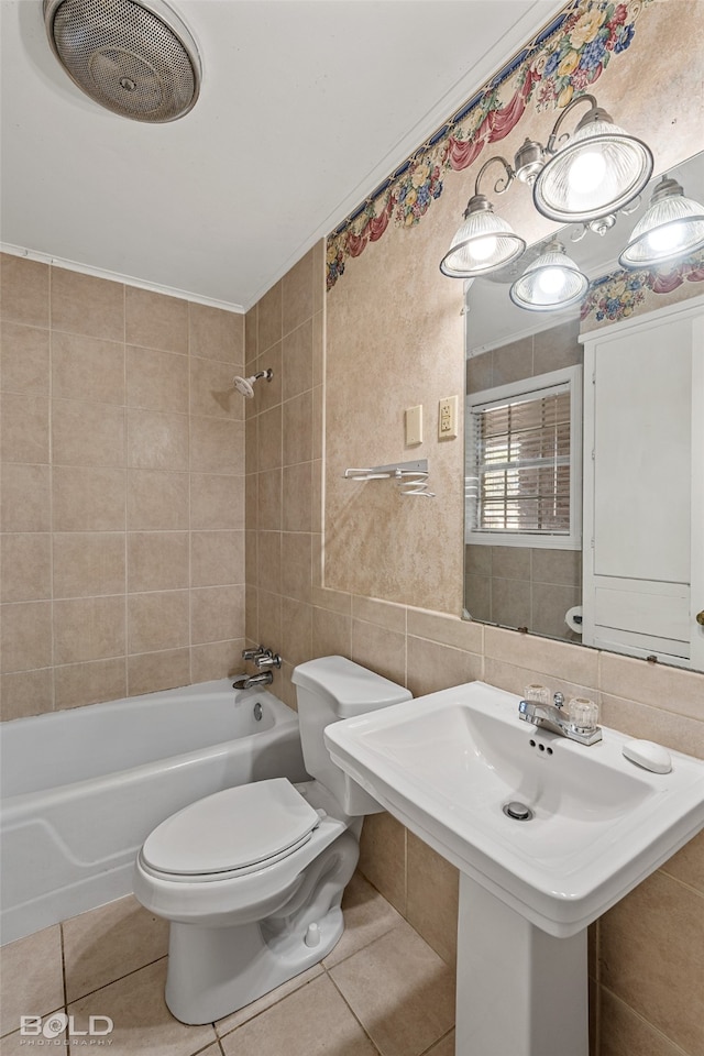 bathroom featuring tile patterned flooring, tiled shower / bath combo, toilet, tile walls, and tasteful backsplash