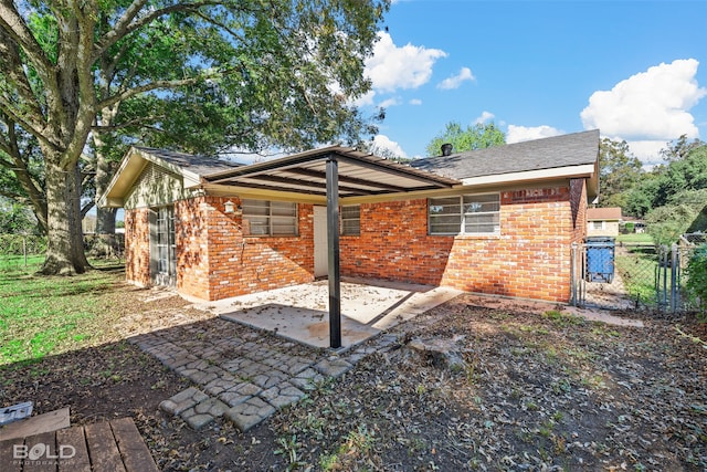 rear view of house with a patio