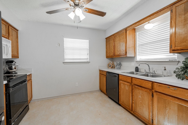 kitchen with a textured ceiling, sink, ceiling fan, and black appliances