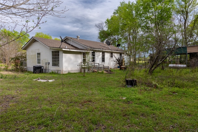 rear view of house with a lawn