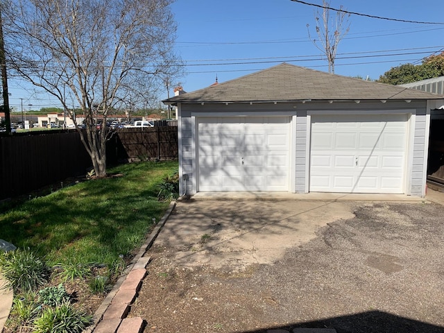 garage featuring a yard