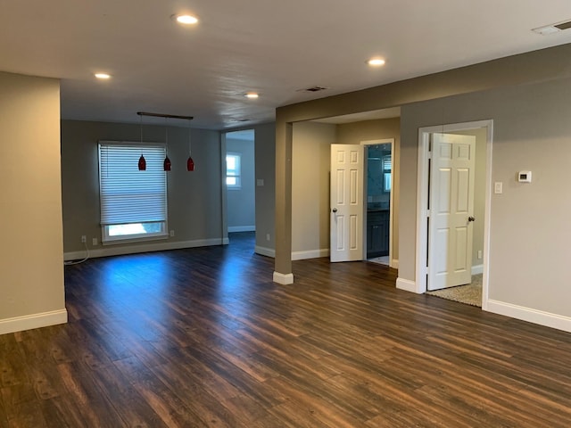 unfurnished room featuring dark hardwood / wood-style flooring