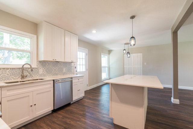 kitchen featuring sink, dark wood-type flooring, dishwasher, and white cabinets