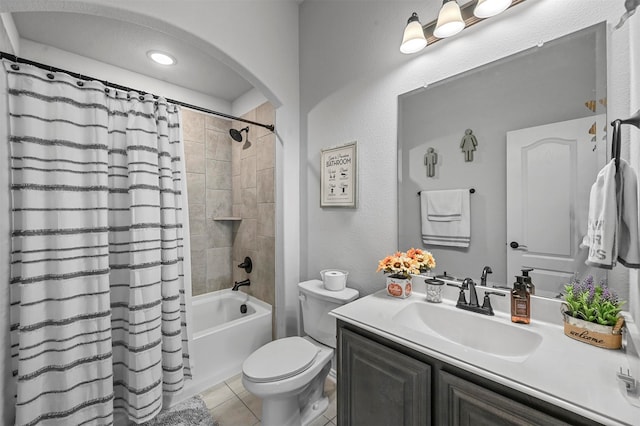 full bathroom featuring vanity, toilet, tile patterned floors, and shower / bathtub combination with curtain