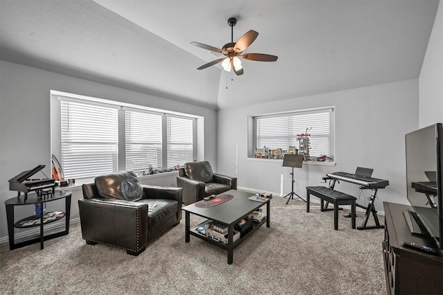 living room featuring a wealth of natural light, lofted ceiling, carpet, and ceiling fan