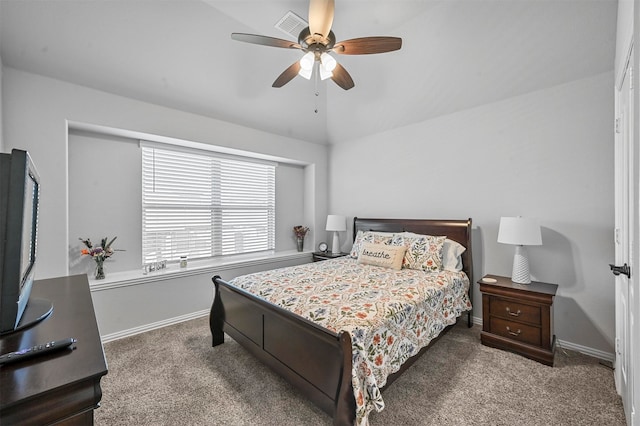 carpeted bedroom with vaulted ceiling and ceiling fan