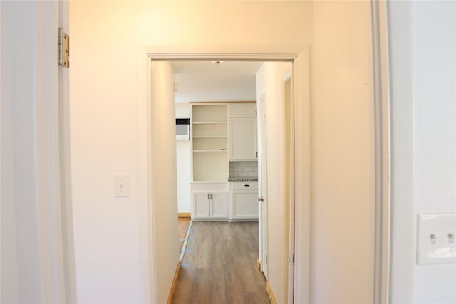 hallway featuring dark hardwood / wood-style flooring