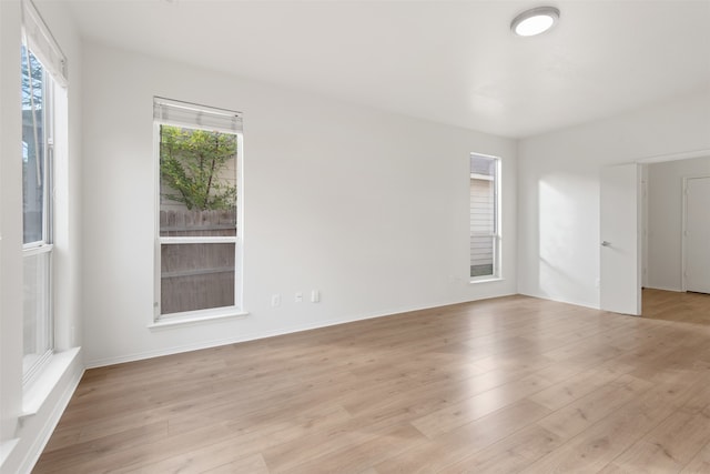 unfurnished room featuring light hardwood / wood-style flooring