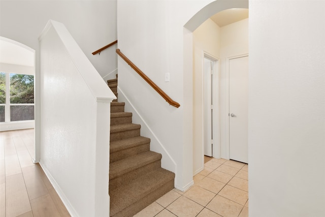 stairs with tile patterned floors