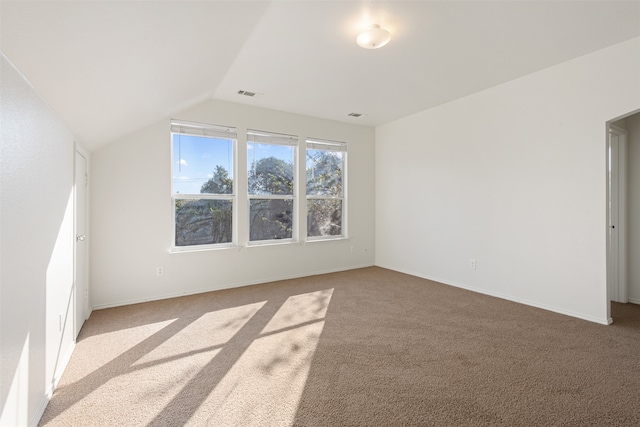 bonus room featuring light carpet and vaulted ceiling