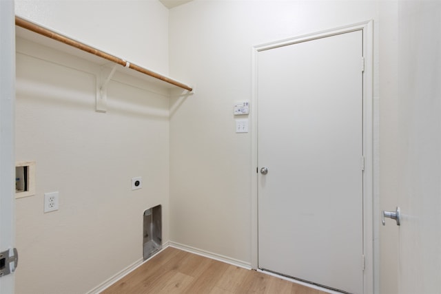 laundry room featuring hookup for a washing machine, light hardwood / wood-style flooring, and hookup for an electric dryer