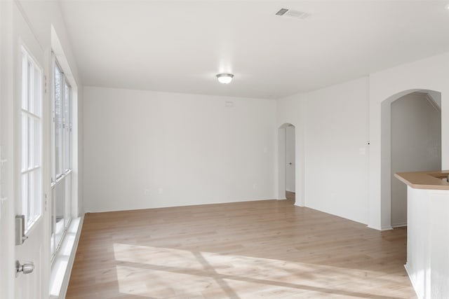 spare room featuring light hardwood / wood-style flooring