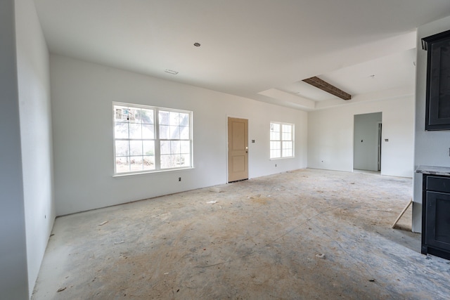 spare room with beam ceiling