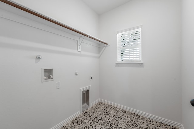 laundry area with baseboards, hookup for a washing machine, hookup for a gas dryer, electric dryer hookup, and laundry area
