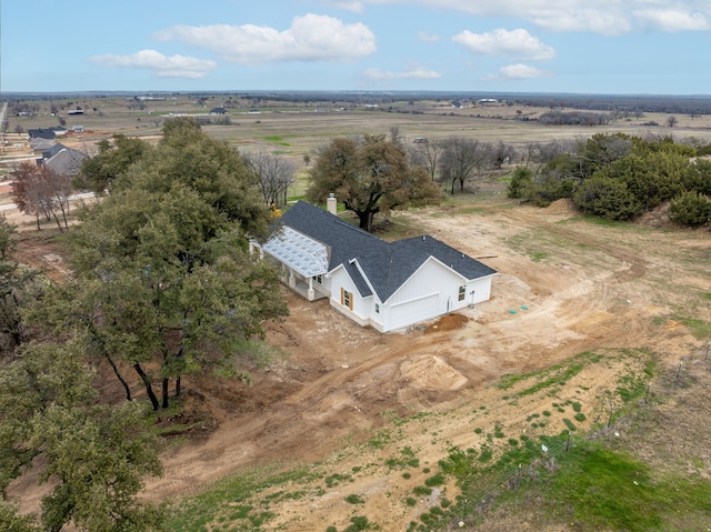 birds eye view of property with a rural view