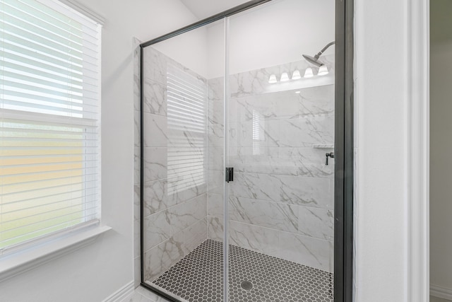 full bathroom with a marble finish shower