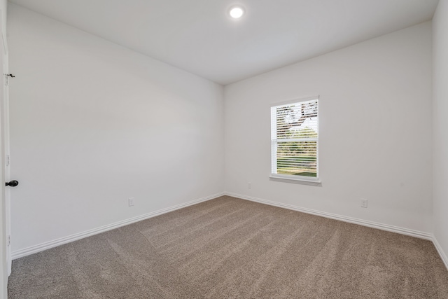unfurnished room with recessed lighting, carpet flooring, and baseboards