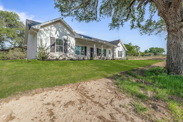 ranch-style home with a front lawn