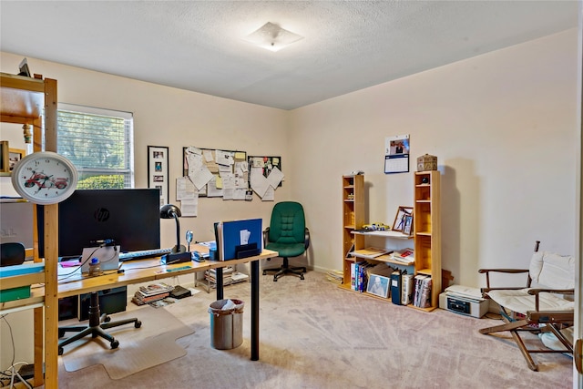 carpeted home office with a textured ceiling