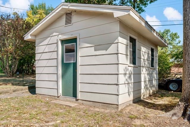 view of side of home with an outbuilding