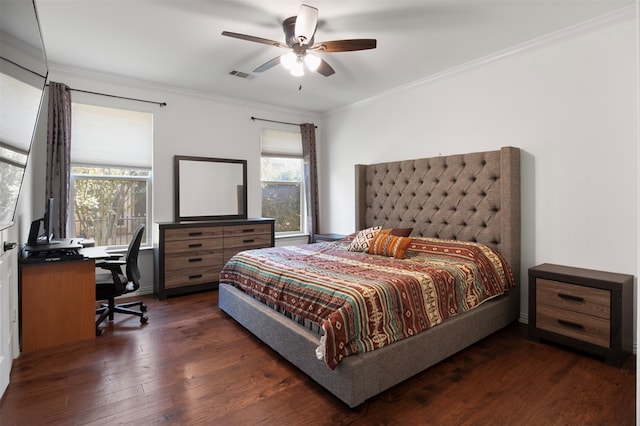 bedroom featuring ceiling fan, dark wood-type flooring, and ornamental molding