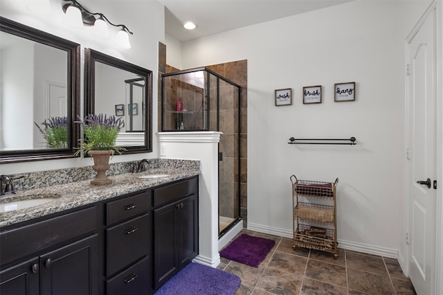 bathroom with vanity and a shower with shower door