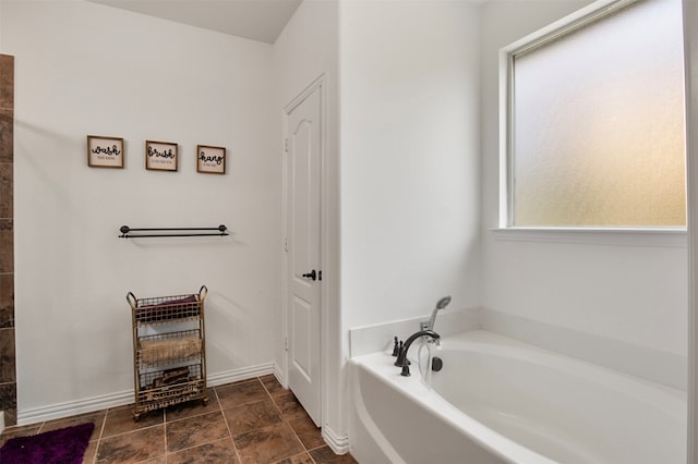 bathroom with a tub to relax in