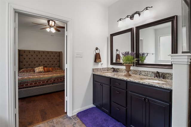 bathroom featuring ceiling fan, vanity, and wood-type flooring