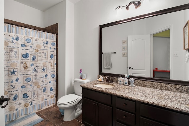 bathroom with tile patterned floors, a shower with curtain, vanity, and toilet