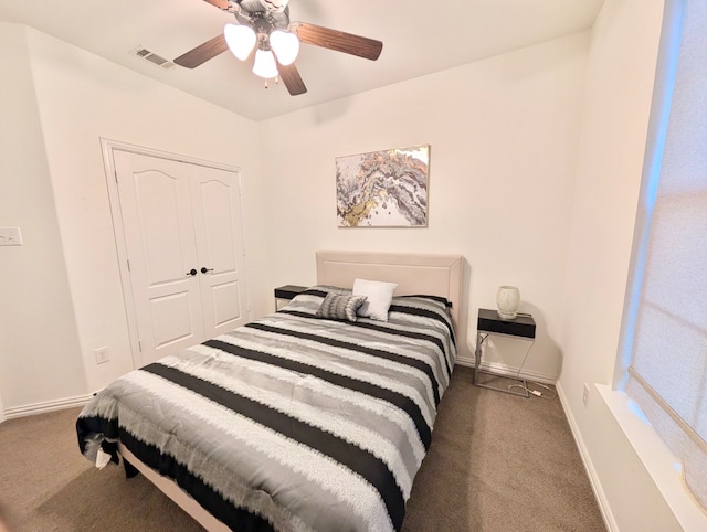 bedroom with ceiling fan, a closet, and carpet floors