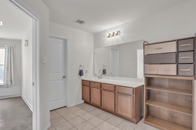 bathroom with vanity and tile patterned flooring