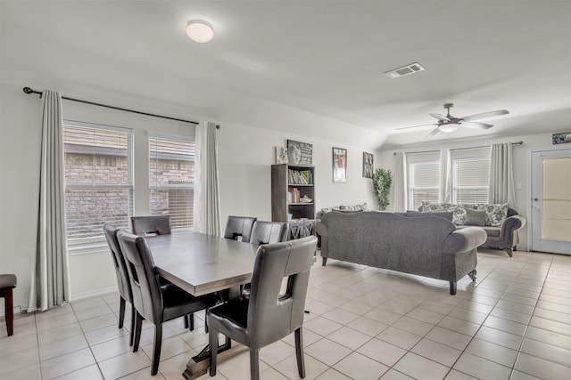 dining room with ceiling fan and light tile patterned floors