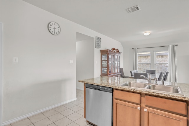 kitchen featuring sink, dishwasher, lofted ceiling, and light tile patterned floors