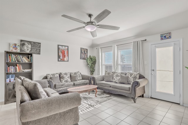 tiled living room with ceiling fan