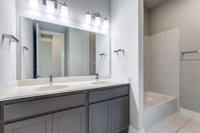 bathroom with vanity, a tub, and tile patterned flooring