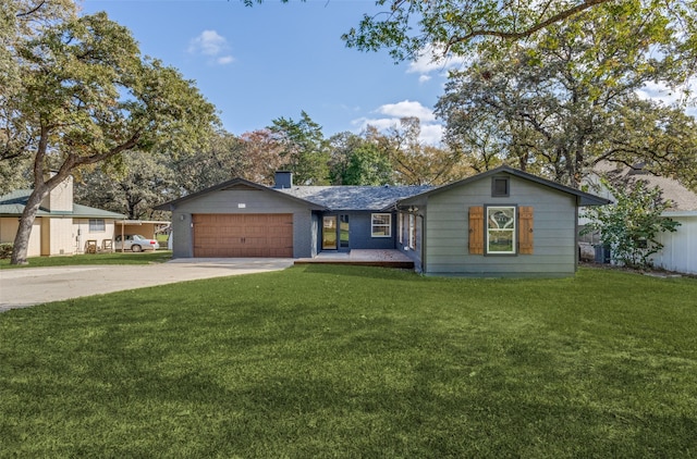 ranch-style home featuring a front lawn and a garage