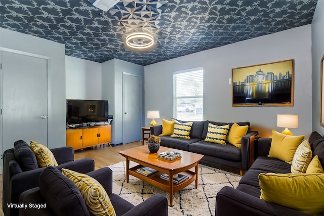 living room with light hardwood / wood-style flooring