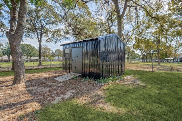 view of outdoor structure with a yard