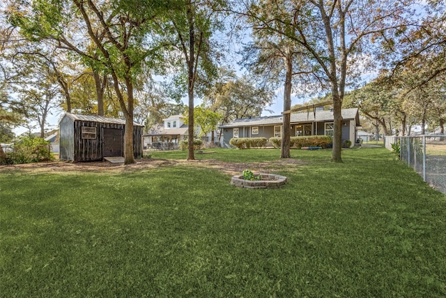 view of yard with a storage unit