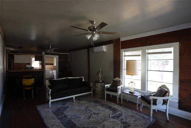 living area with dark hardwood / wood-style flooring, a wall unit AC, and ceiling fan