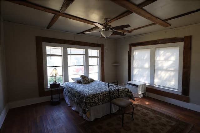 bedroom with coffered ceiling, a wall mounted air conditioner, dark hardwood / wood-style flooring, and ceiling fan