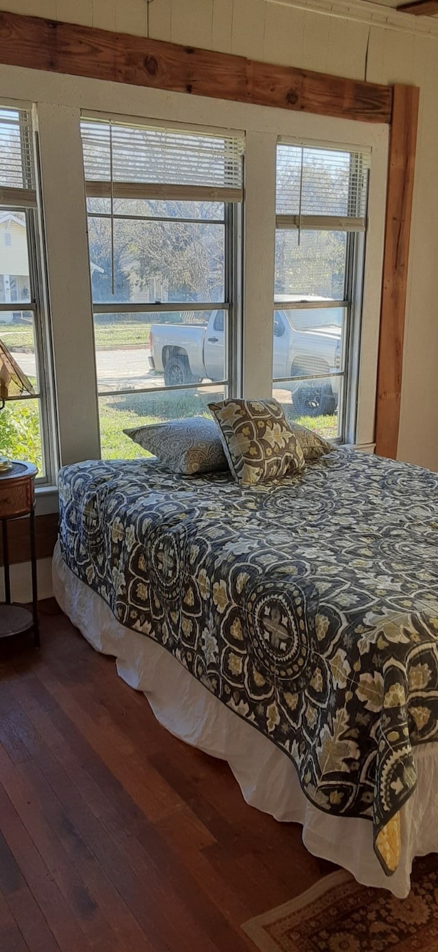 bedroom with hardwood / wood-style flooring