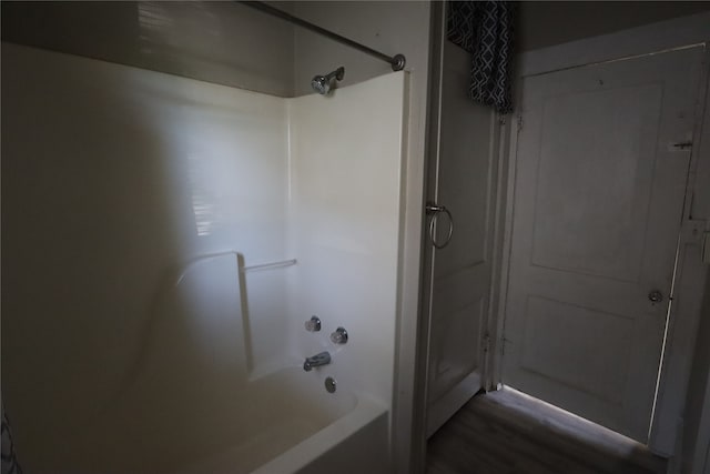 bathroom with shower / washtub combination