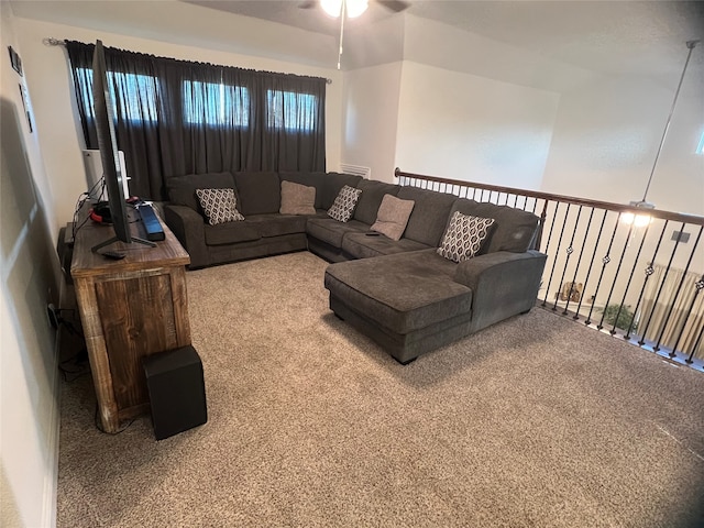 carpeted living room featuring ceiling fan