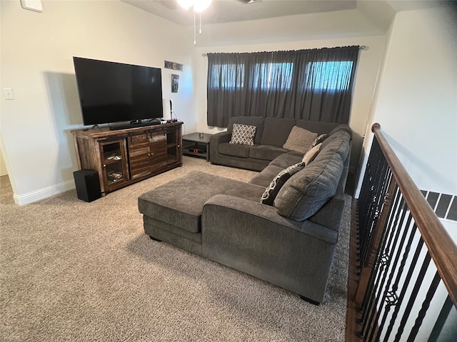 carpeted living room with ceiling fan