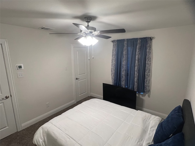 bedroom featuring ceiling fan and dark colored carpet