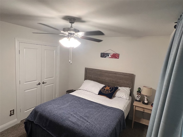 bedroom with dark carpet, a closet, and ceiling fan