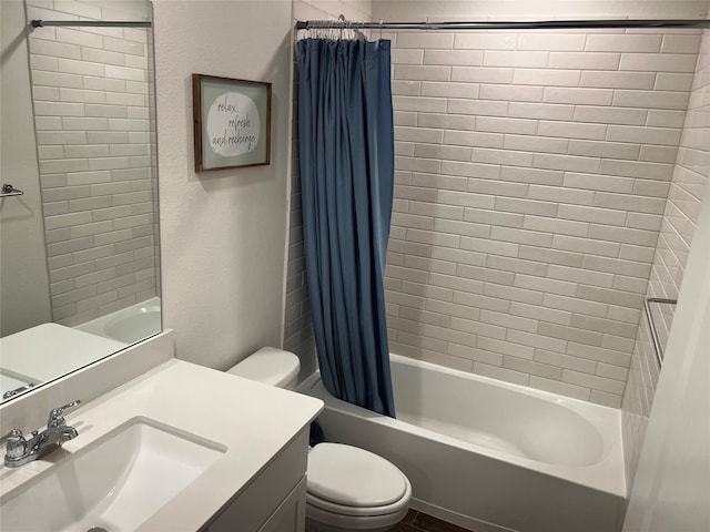 full bathroom with toilet, shower / bath combo with shower curtain, and vanity